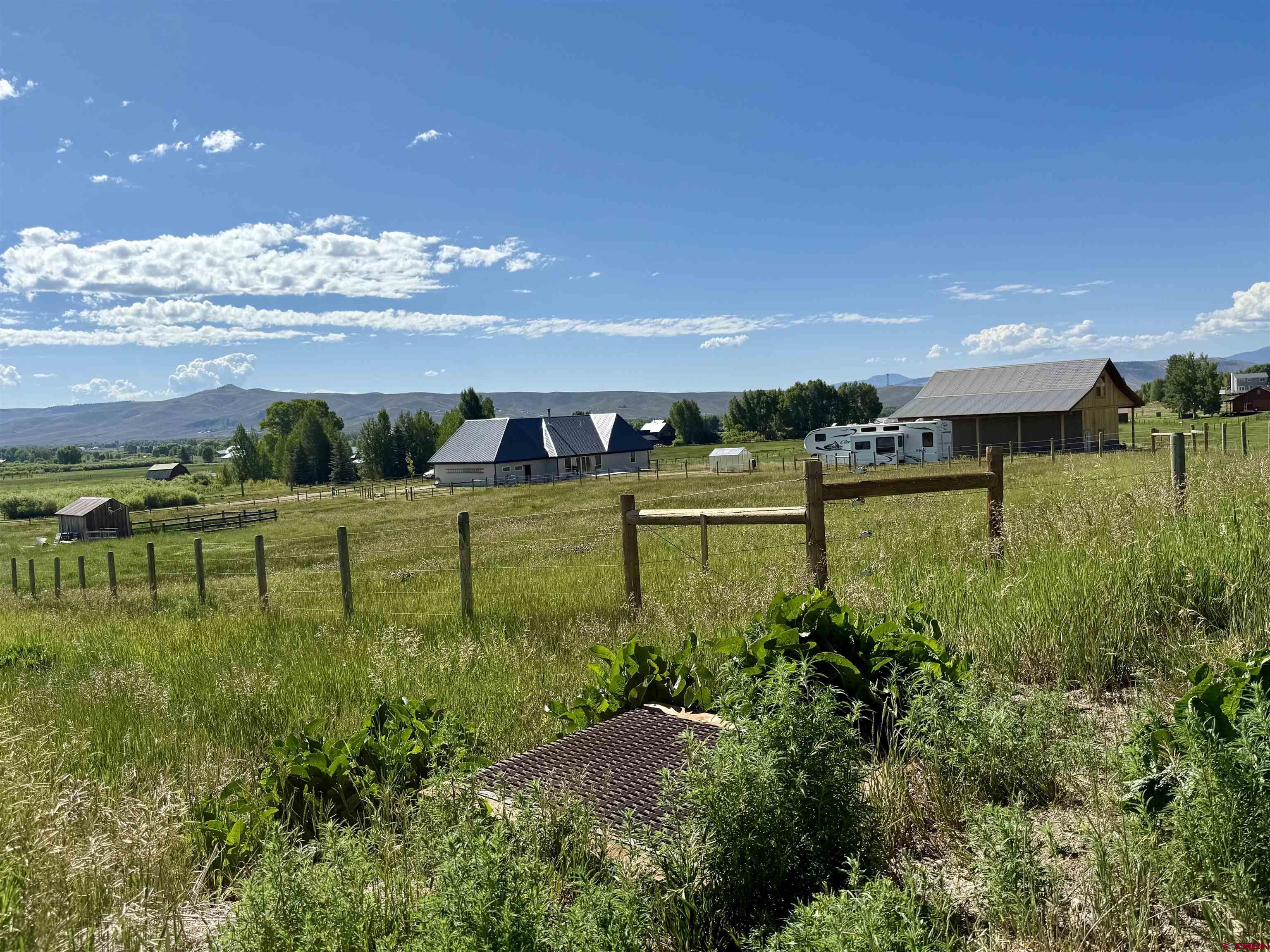 577 Pashuta Drive Gunnison, CO 81230 - Photo 40 of 41 a view of a lake with a big yard