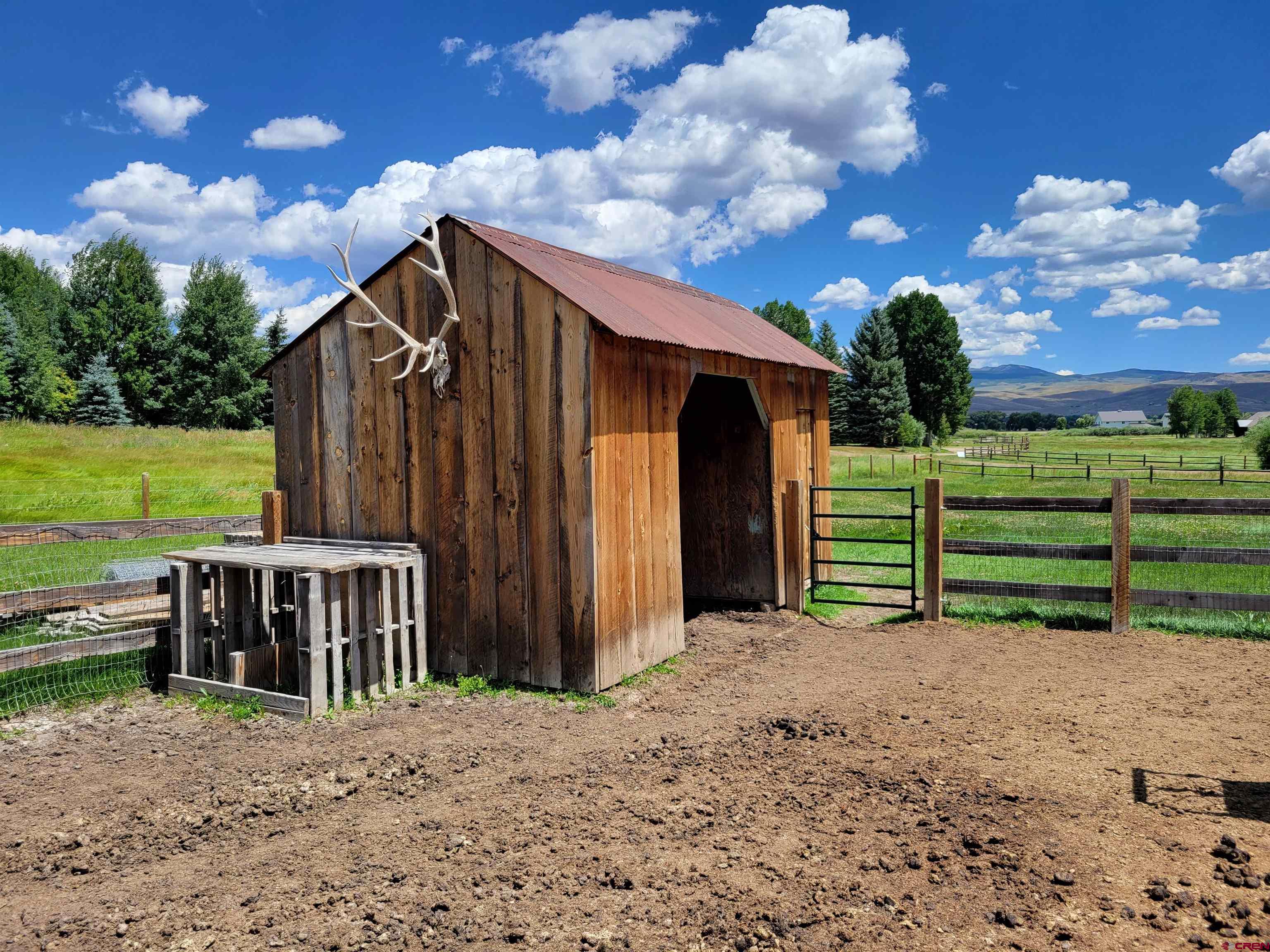 577 Pashuta Drive Gunnison, CO 81230 - Photo 4 of 41 a view of a house with a backyard