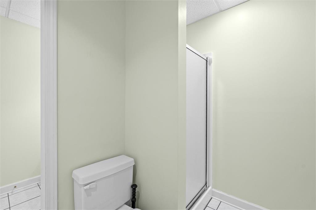 1030 Lakeview Parkway Villa Rica, GA 30180 - Photo 28 of 46 a bathroom with a toilet and a mirror