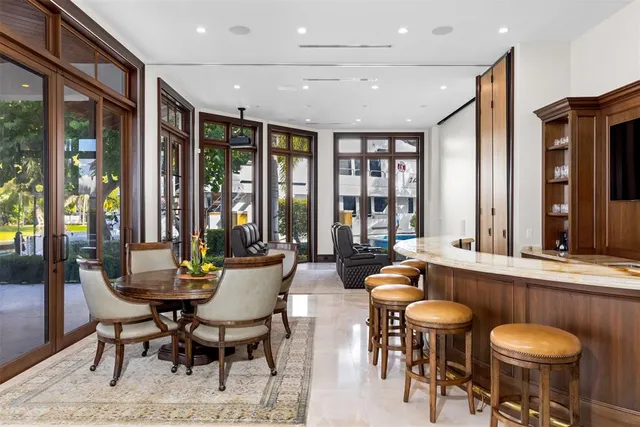 a view of a hallway with a furniture and a chandelier