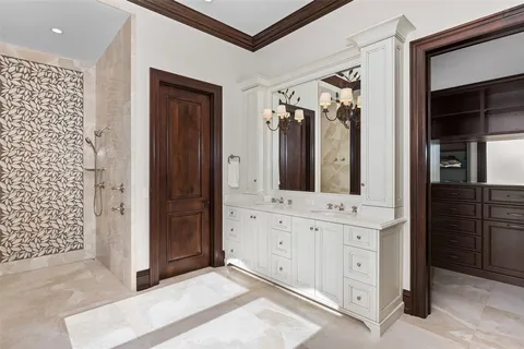 a kitchen with stainless steel appliances kitchen island granite countertop a refrigerator and a stove top oven