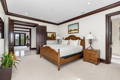 a front view of a house with a garden and plants