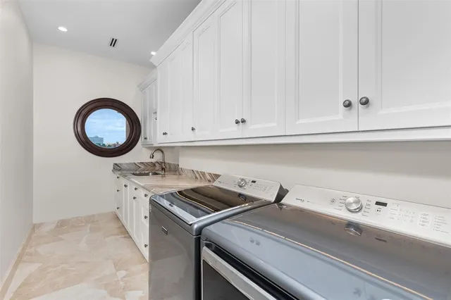 an aerial view of residential house with outdoor space and swimming pool