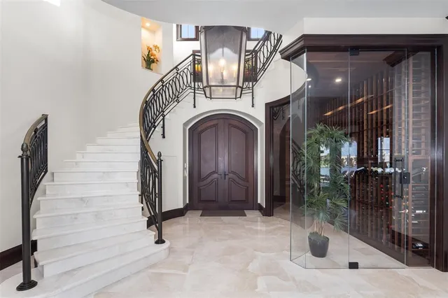 a living room with furniture a large window and a table