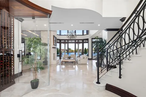 a kitchen with stainless steel appliances granite countertop table chairs stove and sink