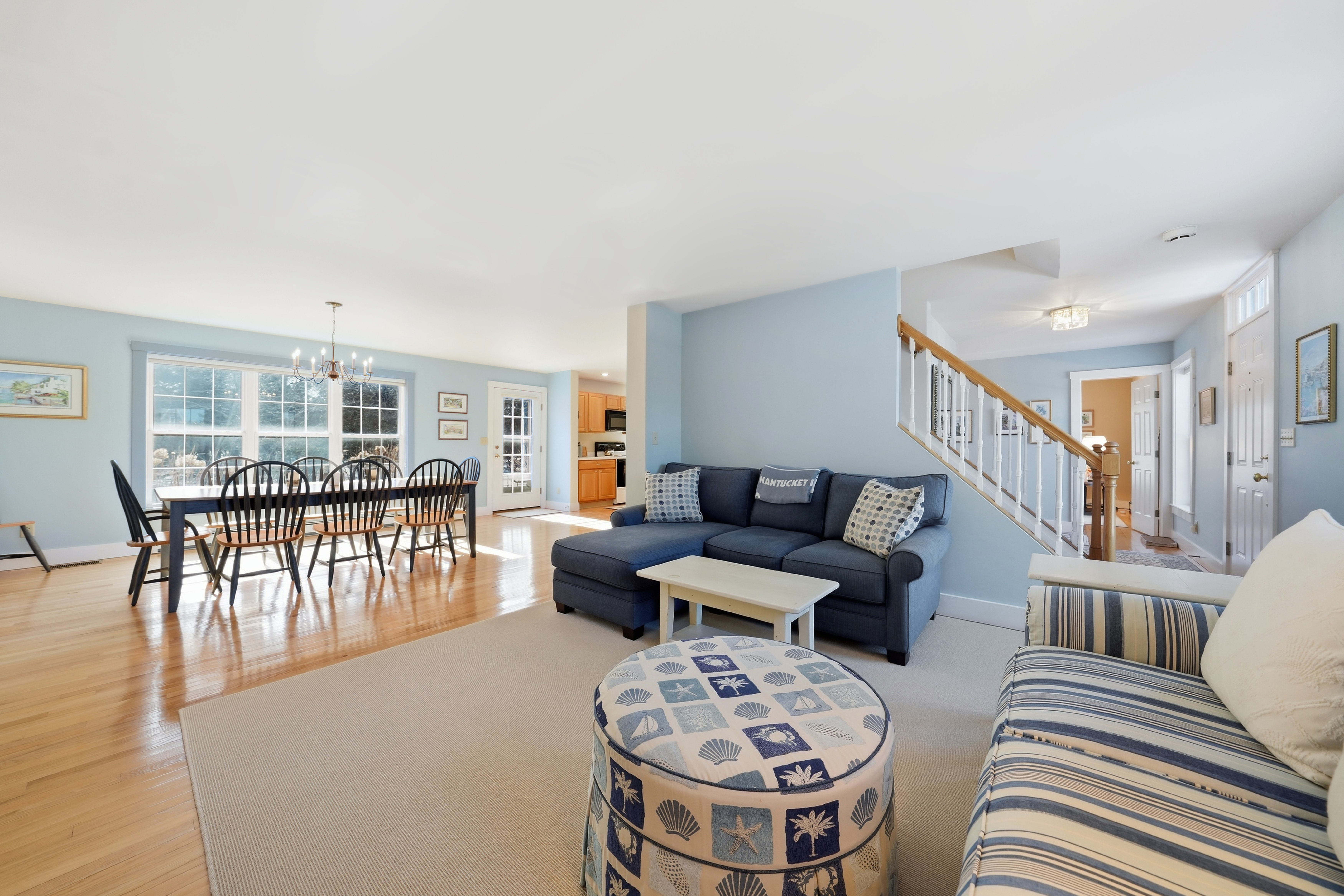 20 Rudder Lane Nantucket, MA 02554 - Photo 7 of 34 a living room with furniture a wooden floor and a dining table