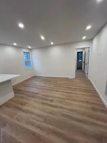 a view of a livingroom with wooden floor