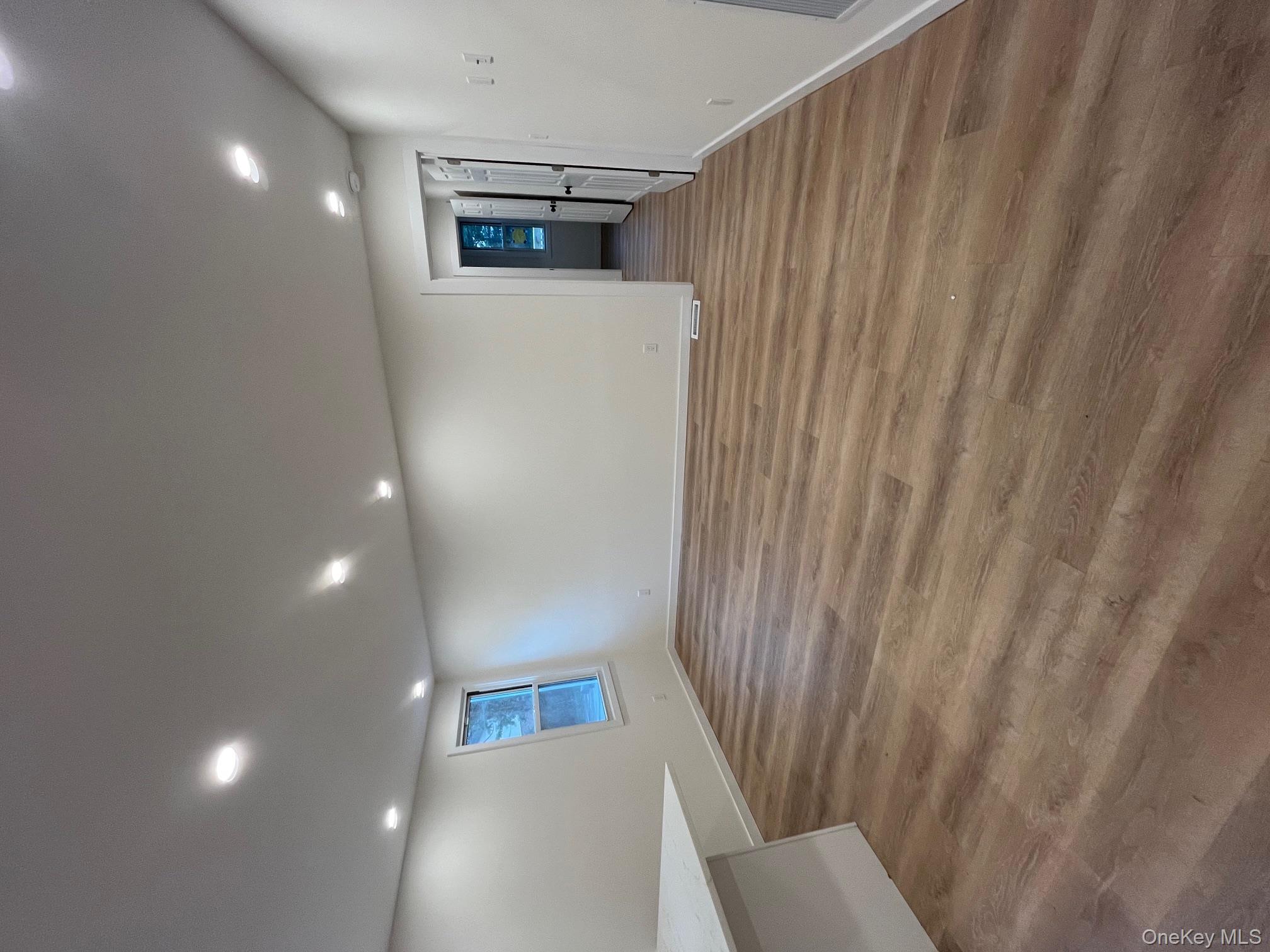 12 Backman Avenue, Unit 1 Ellenville, NY 12428 - Photo 5 of 9 a view of a livingroom with wooden floor