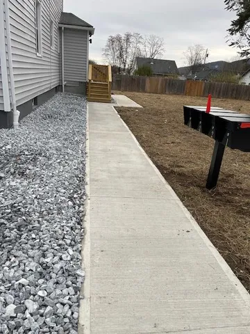 a view of a terrace with wooden fence
