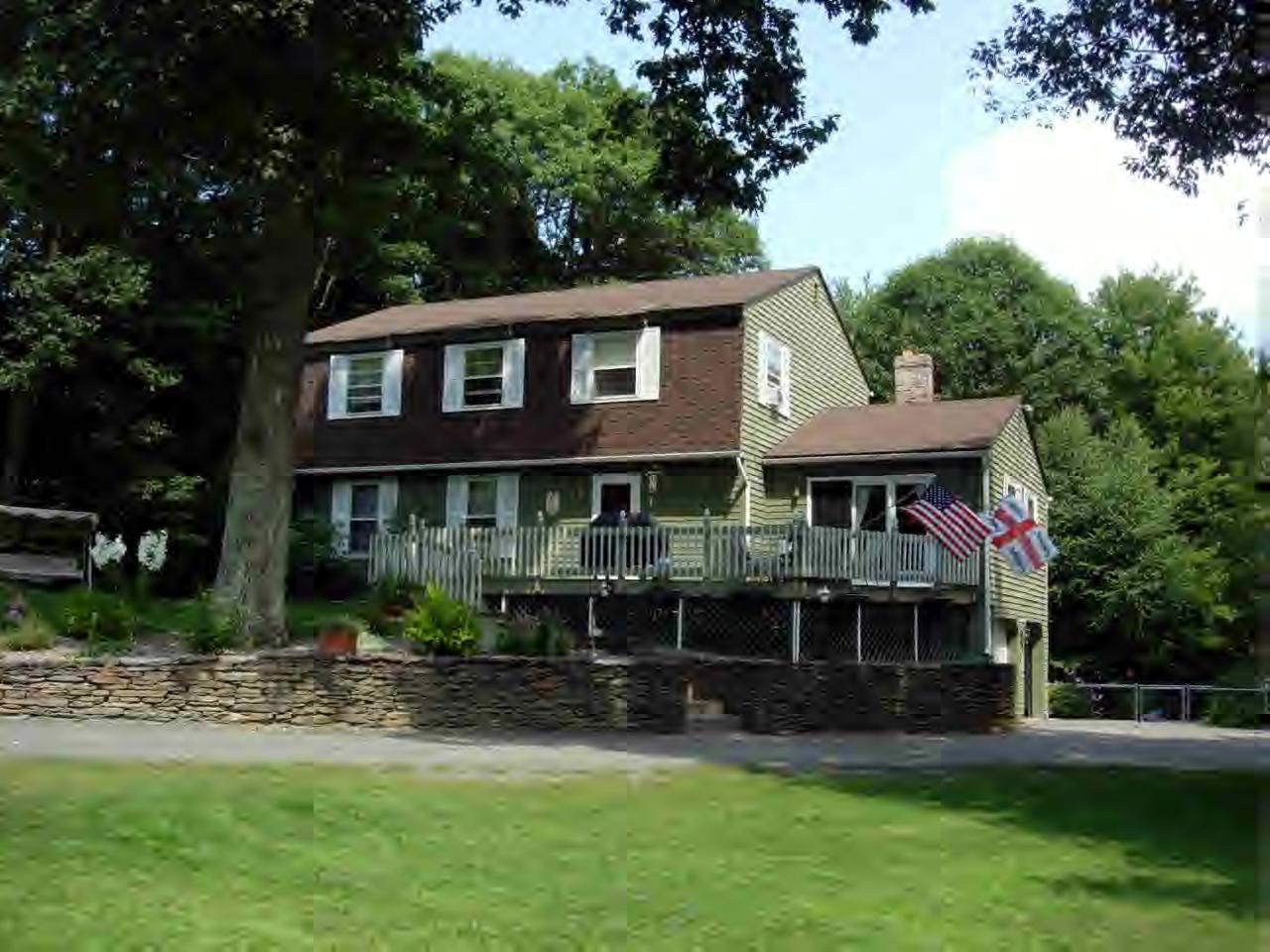 259 NW Road Westhampton, MA 01027 - Photo 2 of 10 a front view of a house with a garden
