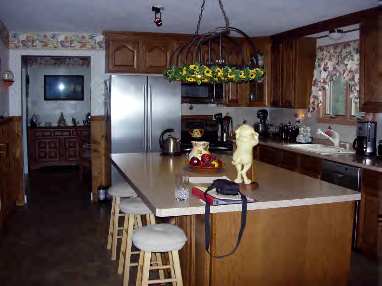 259 NW Road Westhampton, MA 01027 - Photo 10 of 10 a kitchen with a table chairs and a chandelier