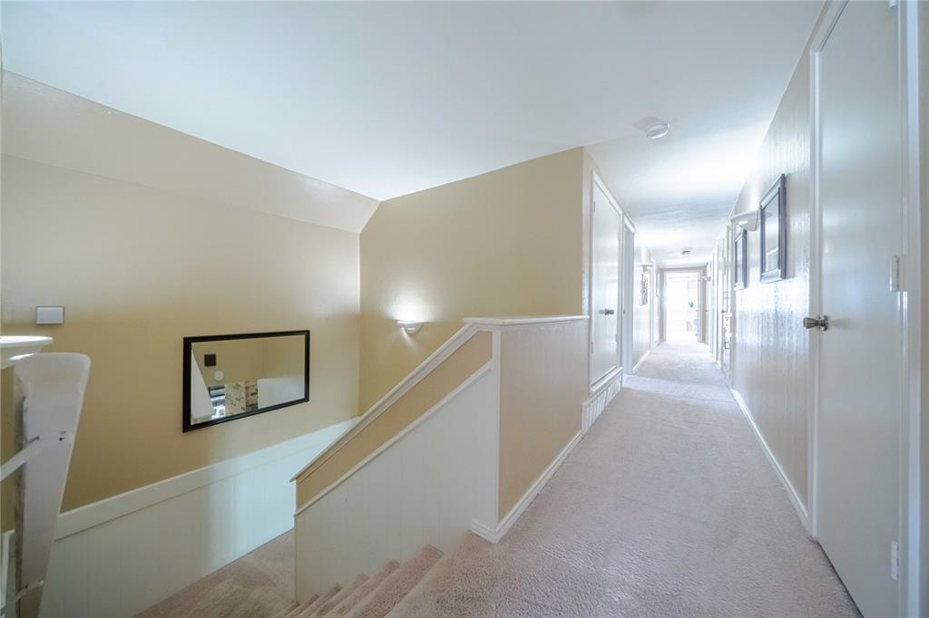 919 Green Hills Road Duncanville, TX 75137 - Photo 22 of 37 Corridor featuring an upstairs landing and light carpet