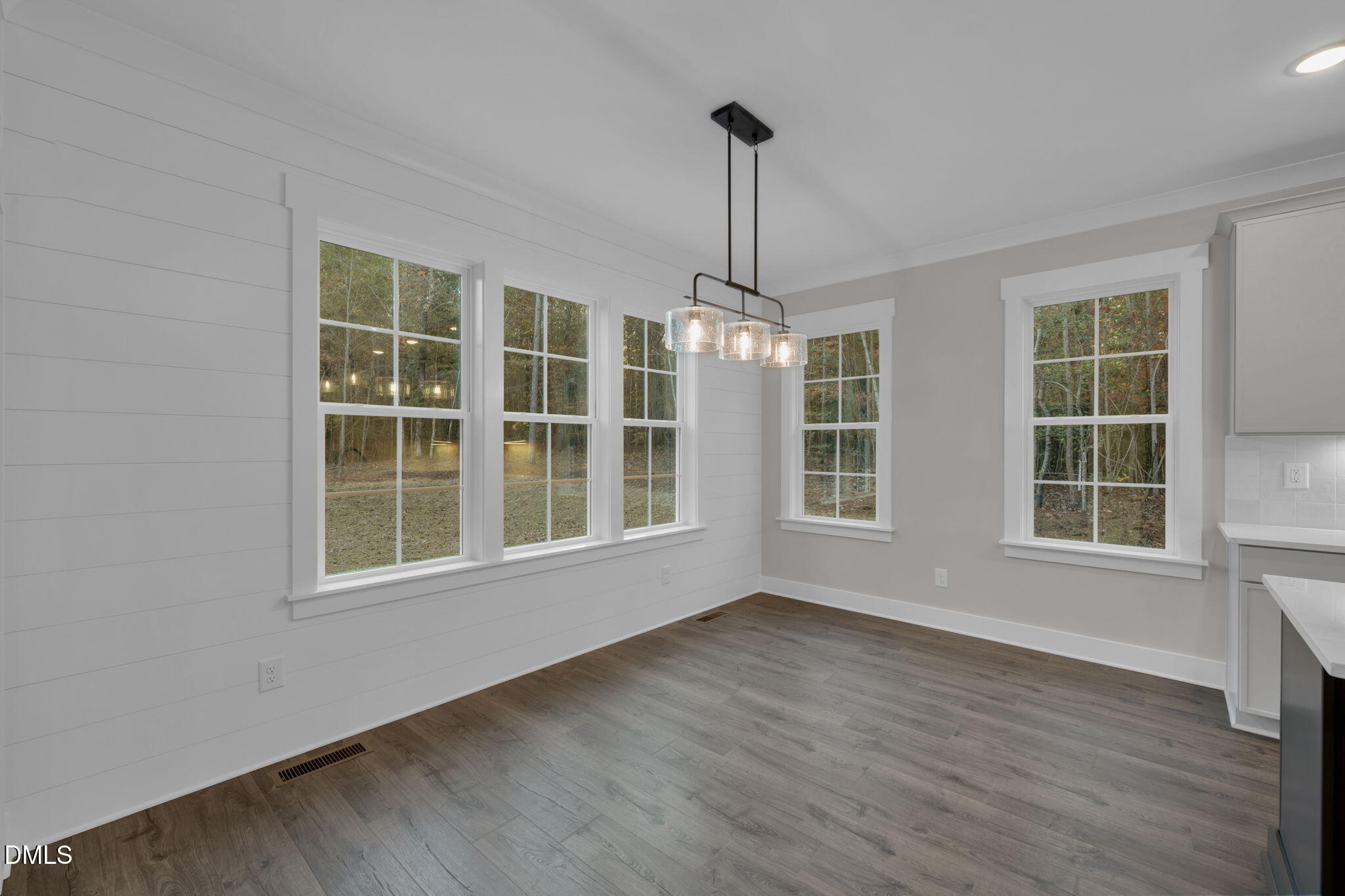 45 Beauview Way Zebulon, NC 27597 - Photo 11 of 40 a view of an empty room with a window and wooden floor