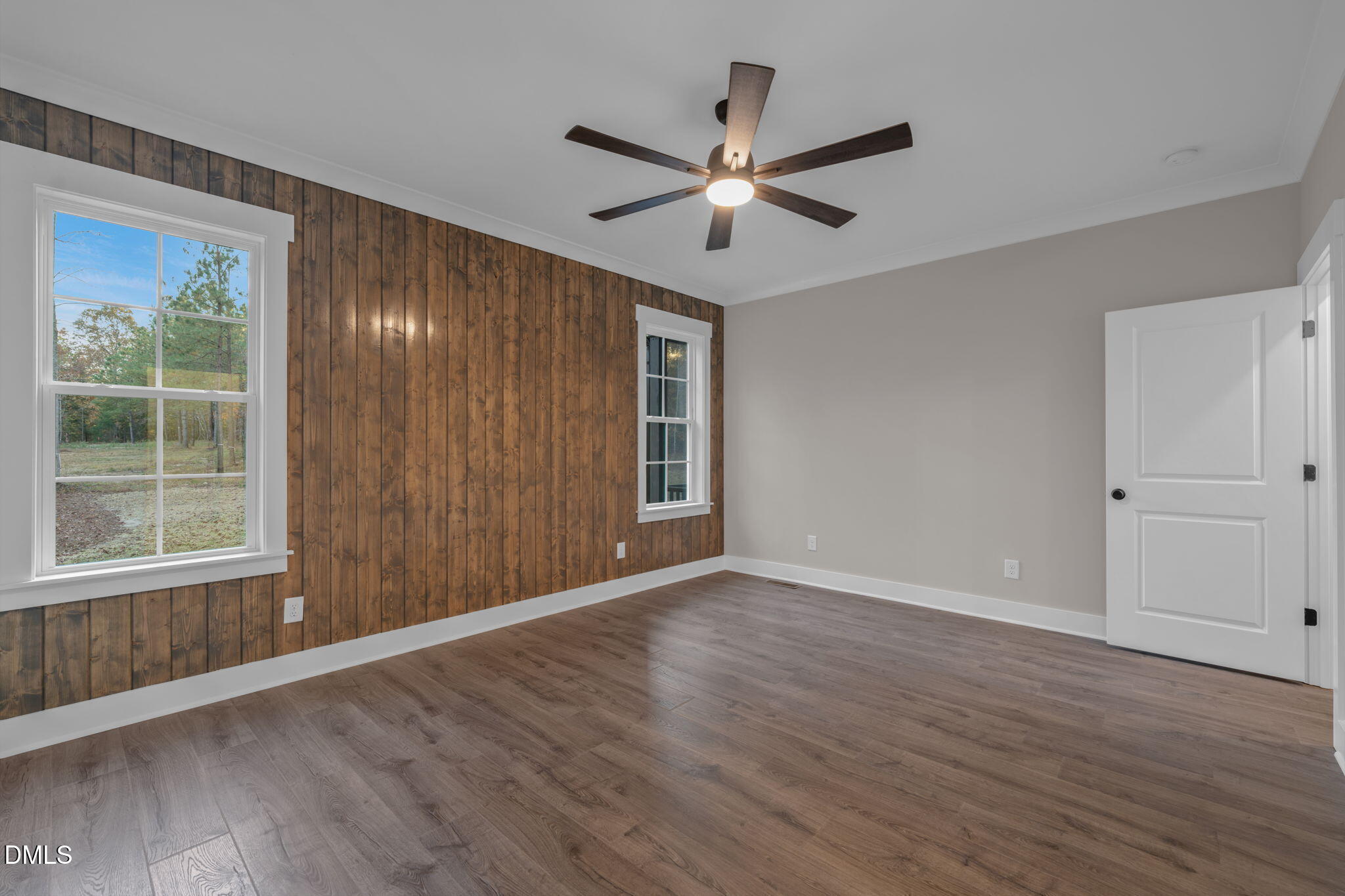 45 Beauview Way Zebulon, NC 27597 - Photo 16 of 40 a view of an empty room with wooden floor and a window