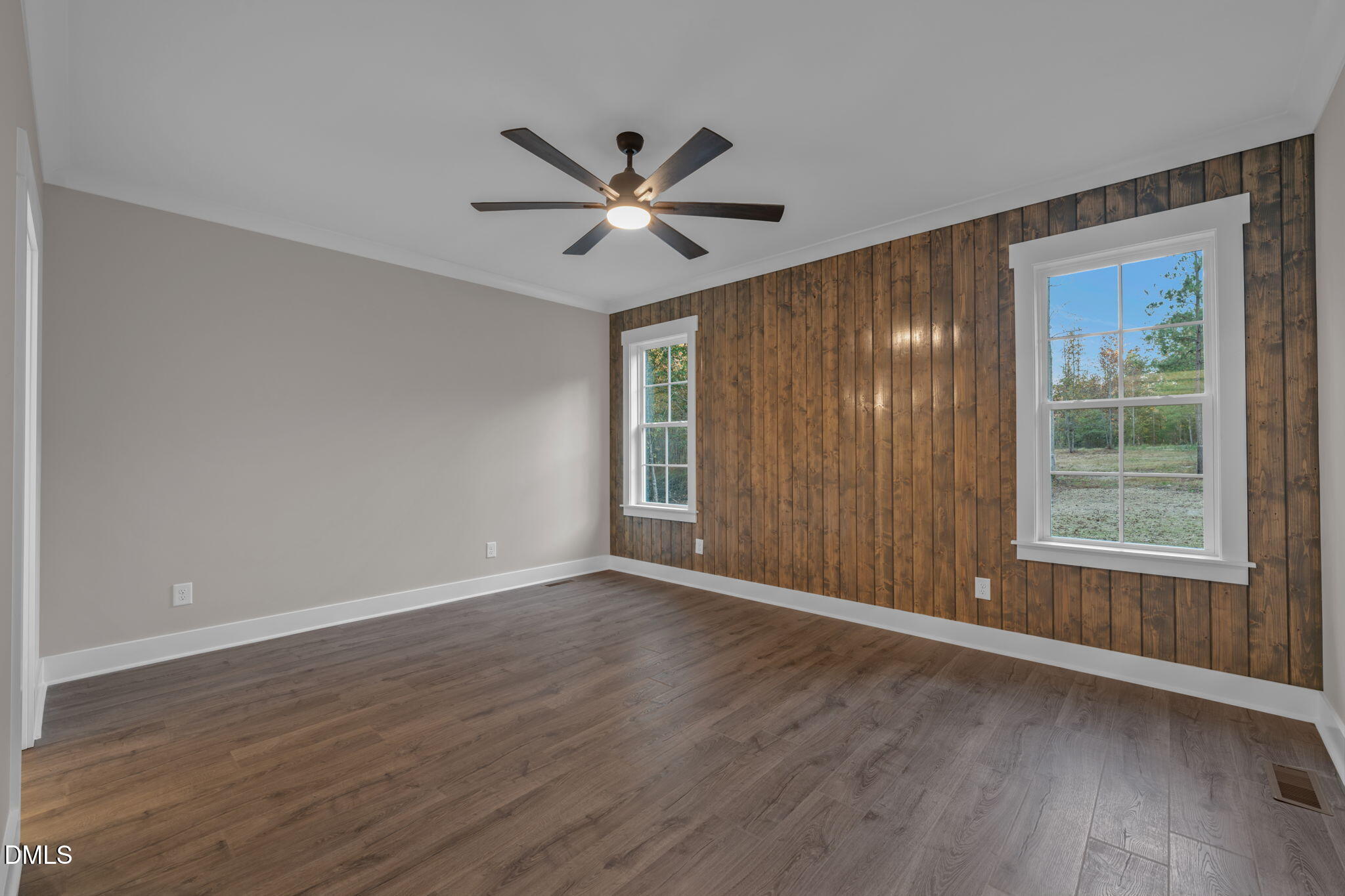 45 Beauview Way Zebulon, NC 27597 - Photo 17 of 40 a view of an empty room with a window and wooden floor