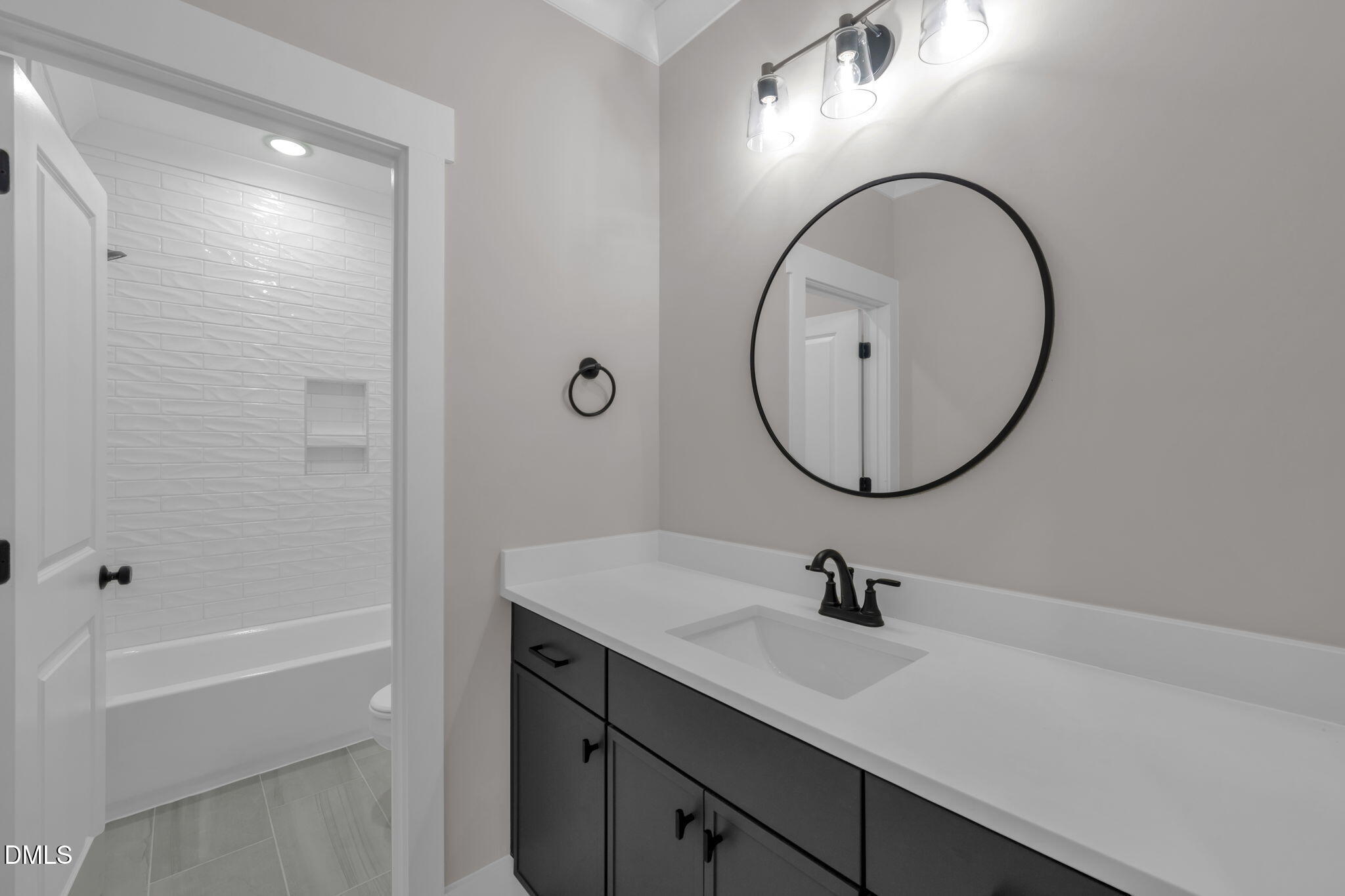 45 Beauview Way Zebulon, NC 27597 - Photo 23 of 40 a bathroom with a sink a toilet and a mirror