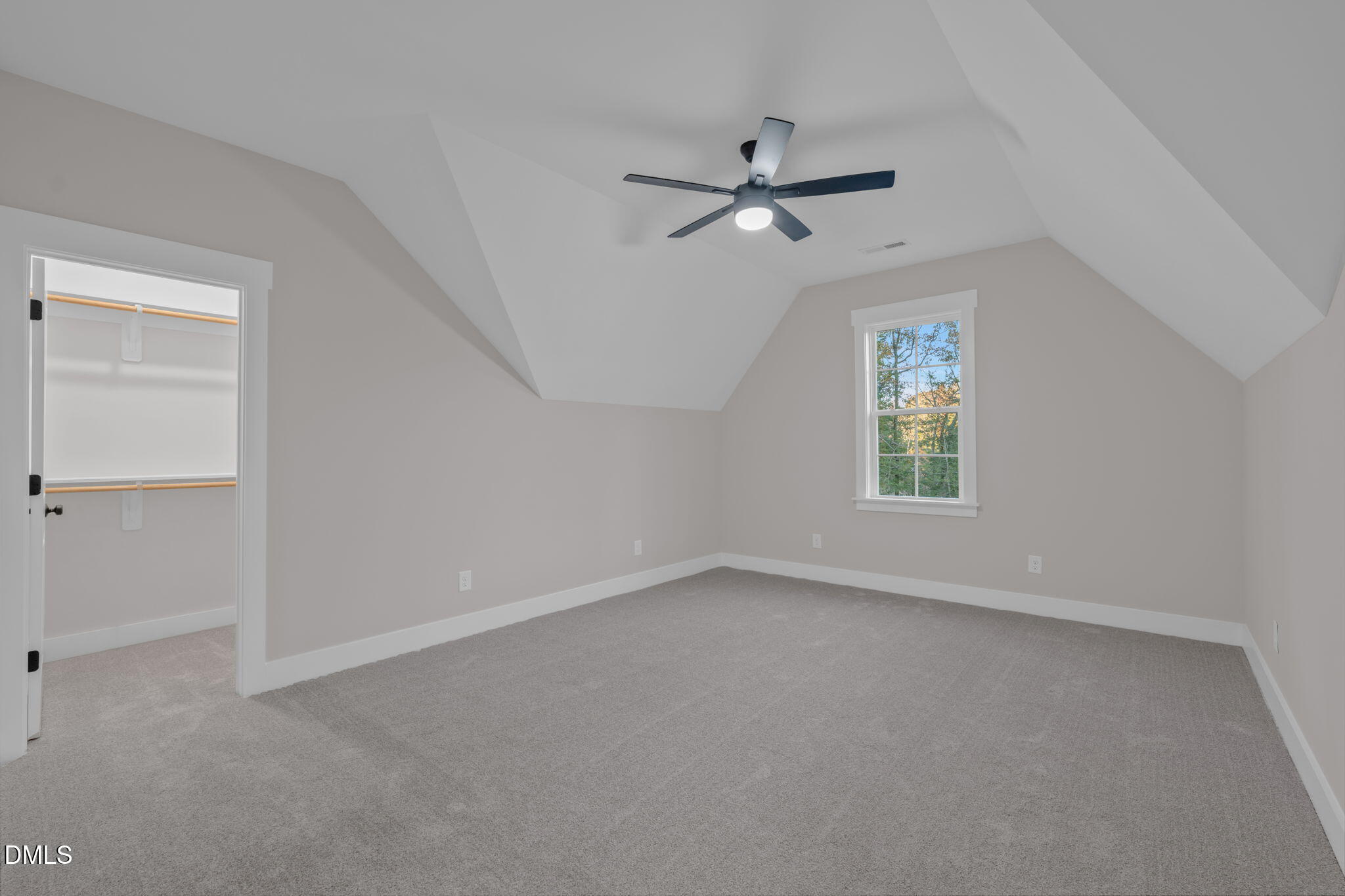 45 Beauview Way Zebulon, NC 27597 - Photo 28 of 40 an empty room with a window and a fan