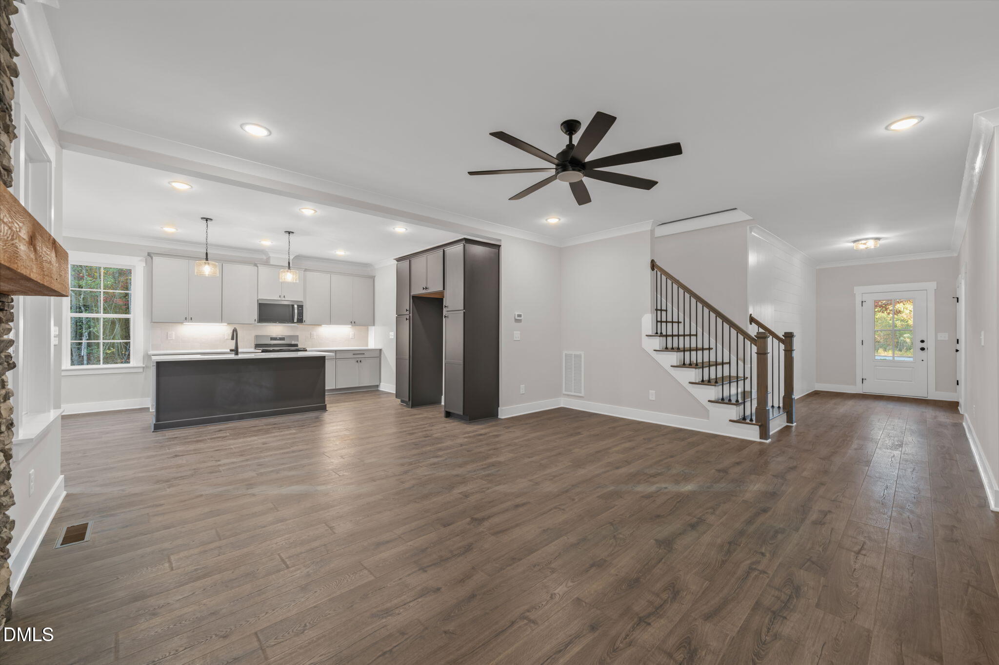 45 Beauview Way Zebulon, NC 27597 - Photo 5 of 40 a view of a big room with wooden floor and a kitchen