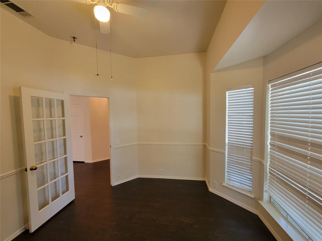 2913 Rush Creek Road McKinney, TX 75072 - Photo 19 of 32 Office with bay window, glass door, and dark wood-style floors, ceiling fan, and lofted ceiling