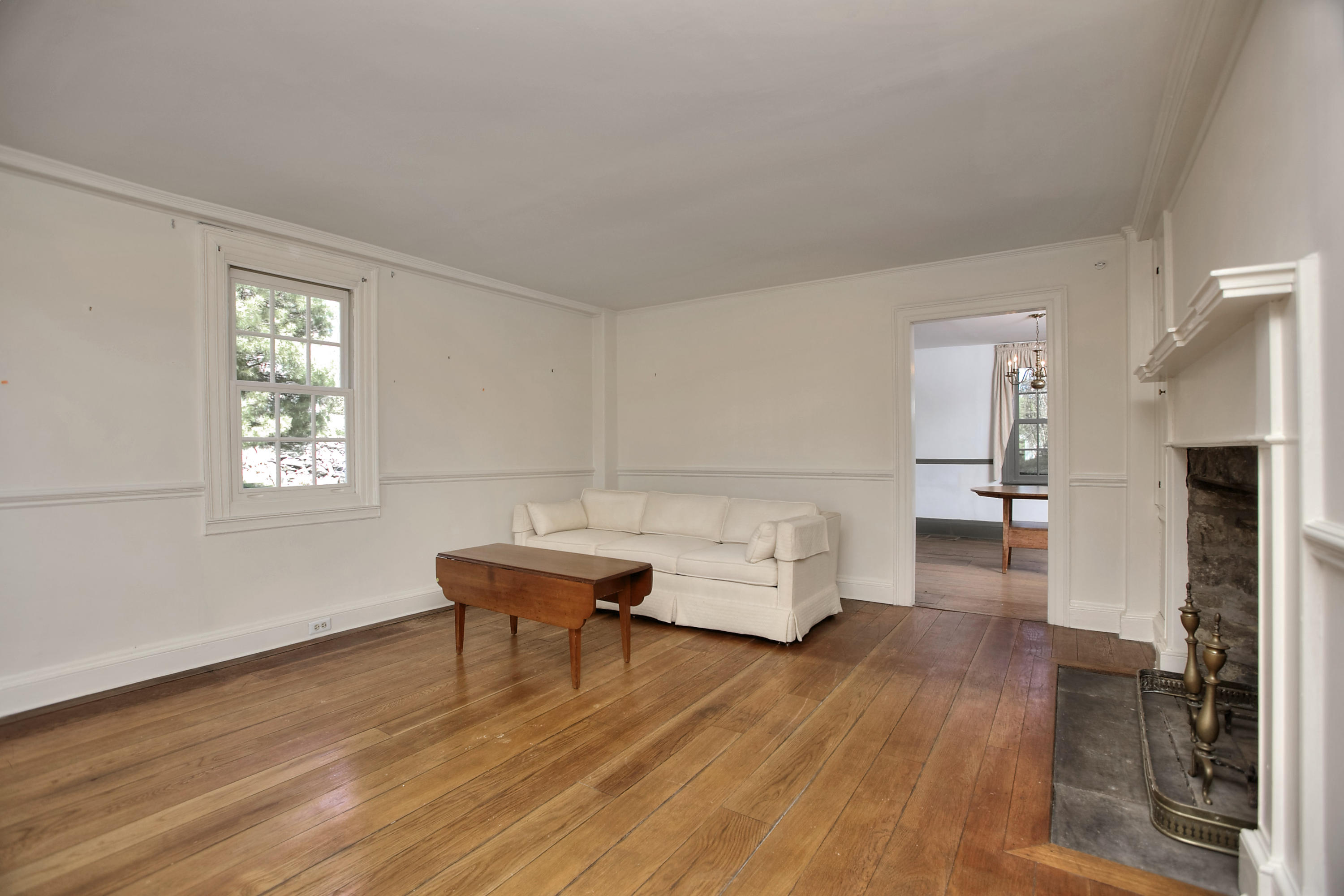 85 Rings End Road Darien, CT 06820 - Photo 8 of 39 a living room with furniture and a wooden floor
