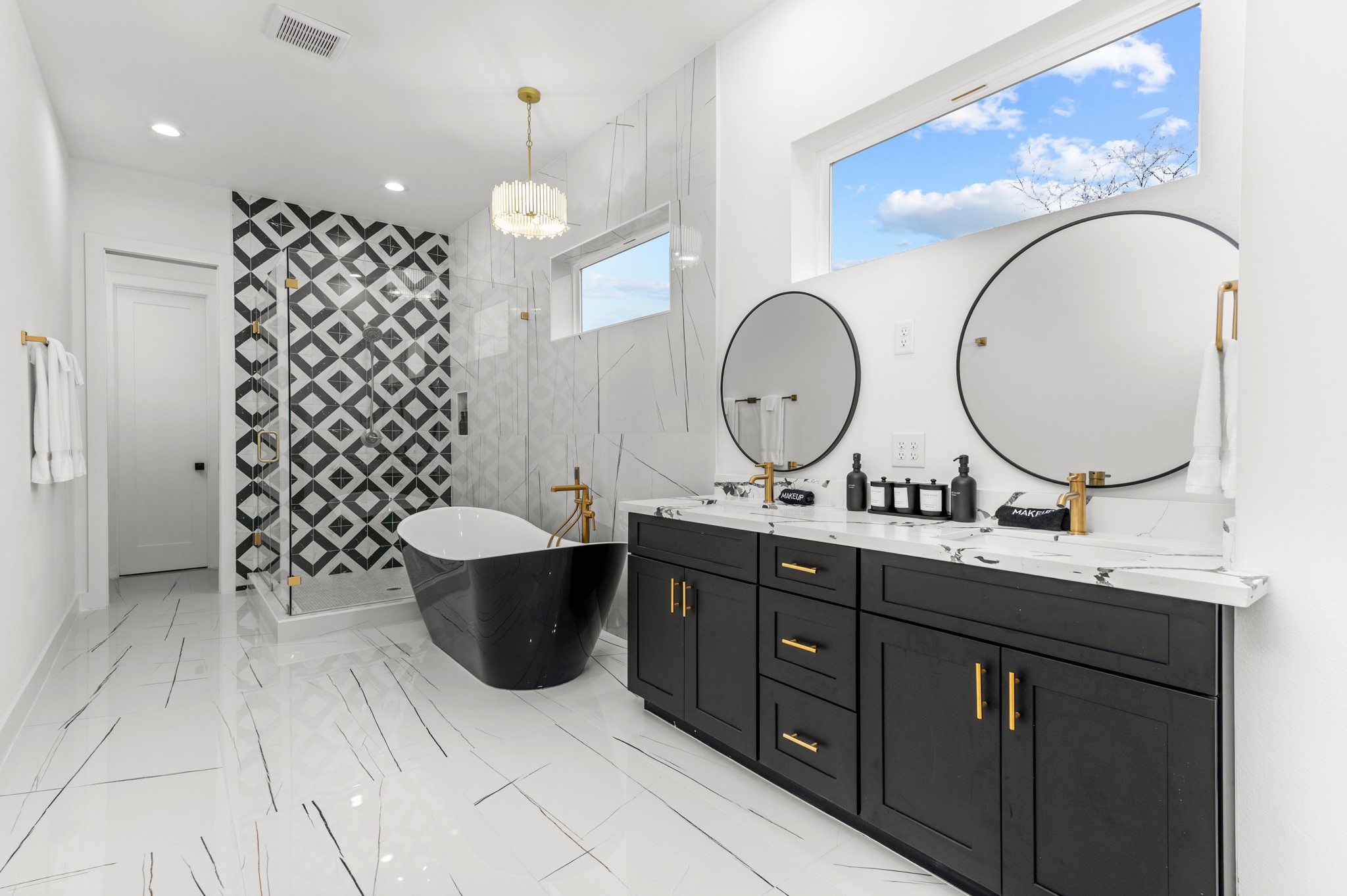 3313 Hadley Street, Unit B Houston, TX 77004 - Photo 9 of 26 a bathroom with a double vanity sink toilet and a mirror