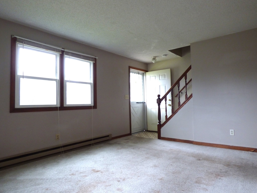 16-18 Daniel Street Springfield, MA 01151 - Photo 6 of 14 a view of an empty room with stairs
