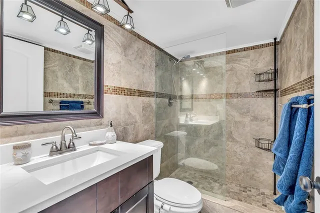 a bedroom with two beds and a large window