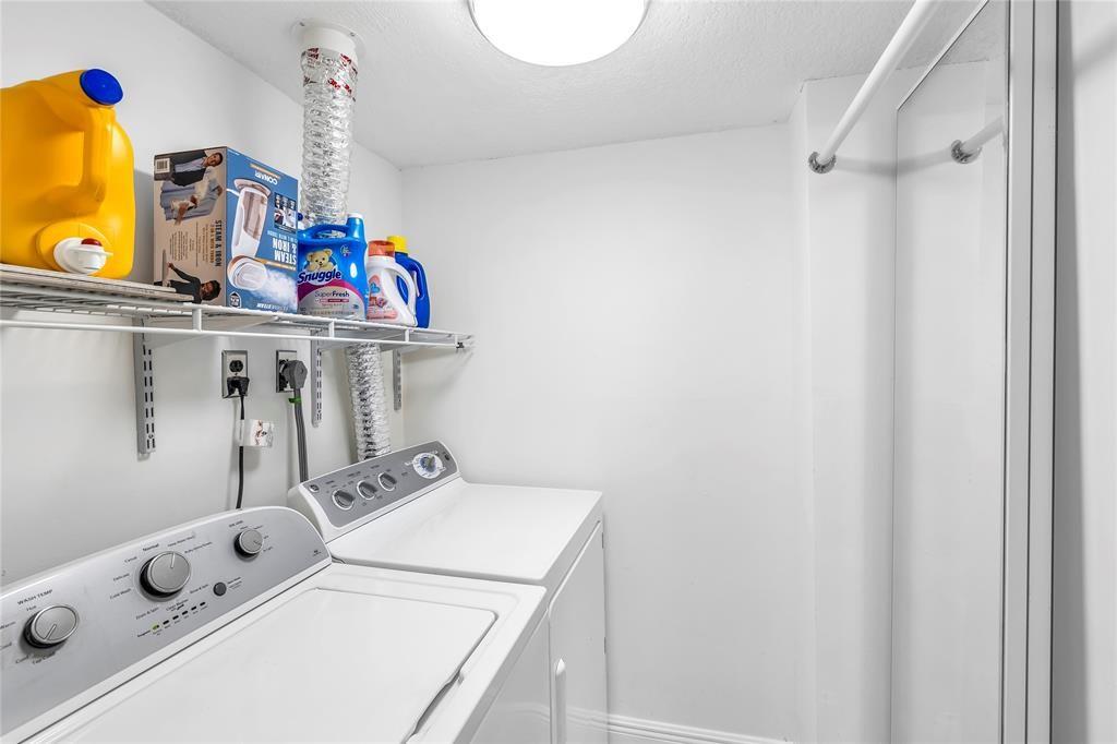 3150 Northeast 48th Court, Unit 204 Lighthouse Point, FL 33064 - Photo 20 of 28 a utility room with dryer and washer