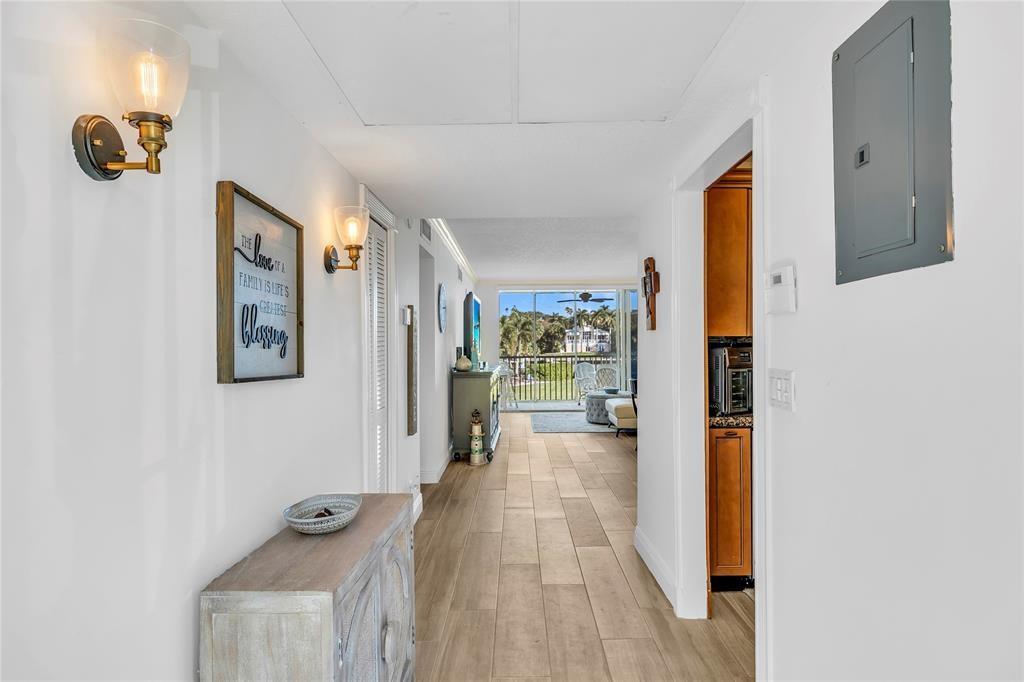 3150 Northeast 48th Court, Unit 204 Lighthouse Point, FL 33064 - Photo 4 of 28 a view of a hallway with interior of the house