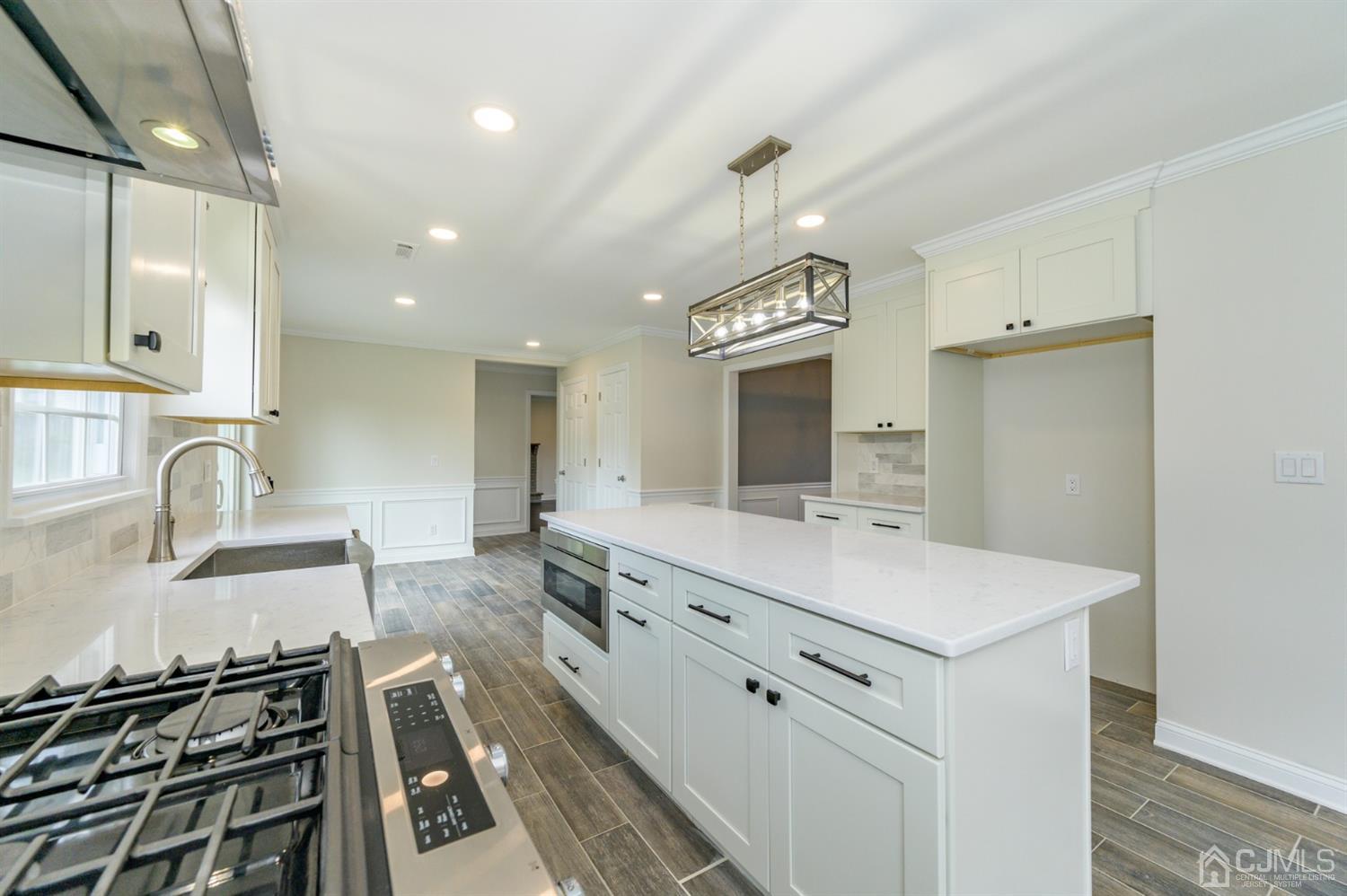 14 Shetland Road Florham Park, NJ 07932 - Photo 14 of 40 a large white kitchen with a stove a sink and a refrigerator