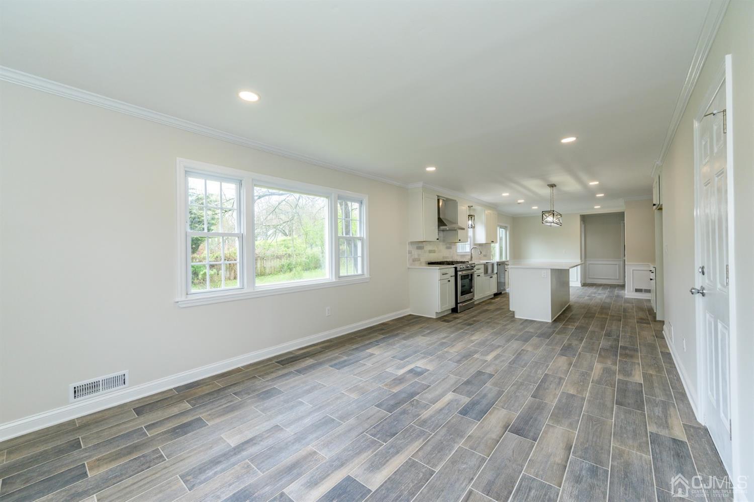 14 Shetland Road Florham Park, NJ 07932 - Photo 16 of 40 a view of a kitchen with wooden floor and windows