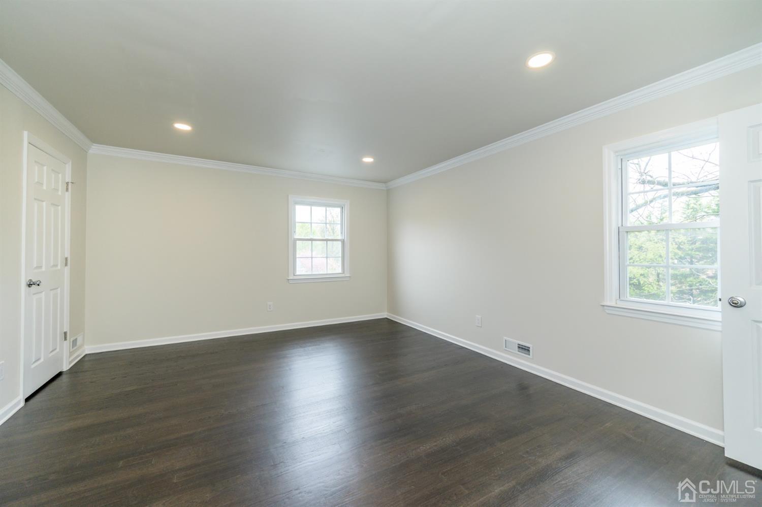 14 Shetland Road Florham Park, NJ 07932 - Photo 19 of 40 an empty room with wooden floor and windows