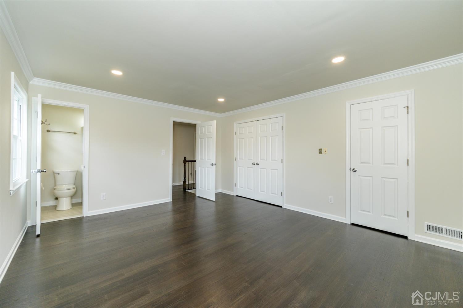 14 Shetland Road Florham Park, NJ 07932 - Photo 21 of 40 an empty room with wooden floor and windows
