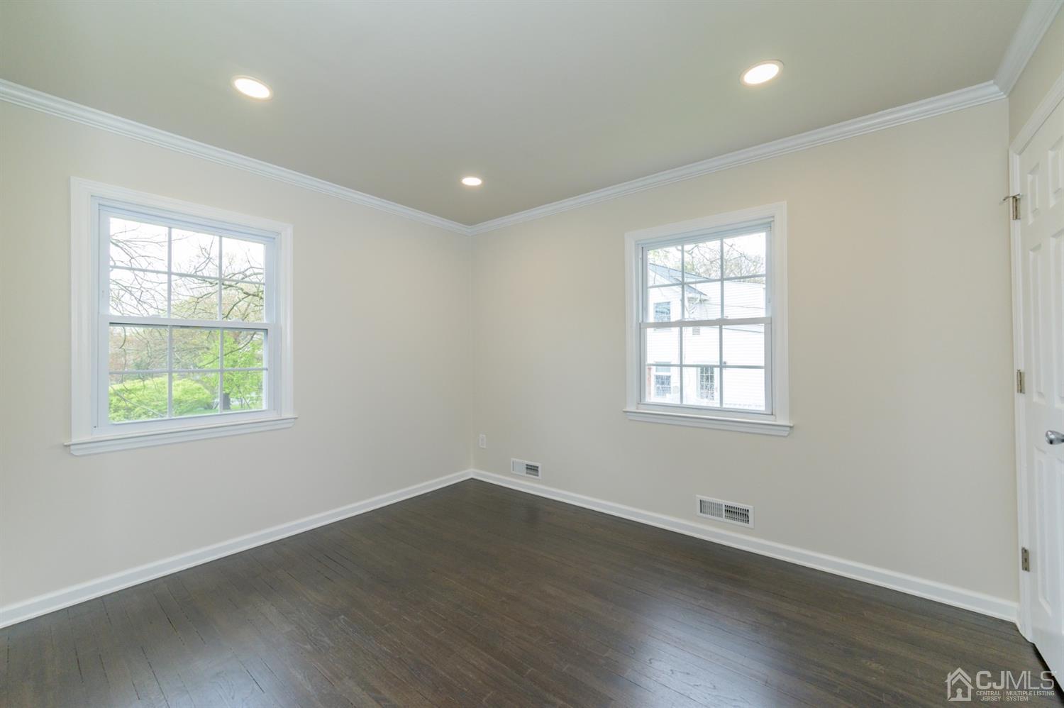 14 Shetland Road Florham Park, NJ 07932 - Photo 23 of 40 an empty room with wooden floor and windows
