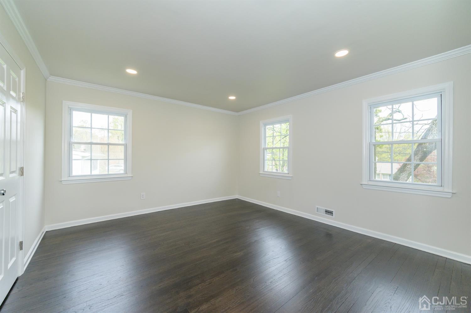 14 Shetland Road Florham Park, NJ 07932 - Photo 25 of 40 an empty room with wooden floor and windows