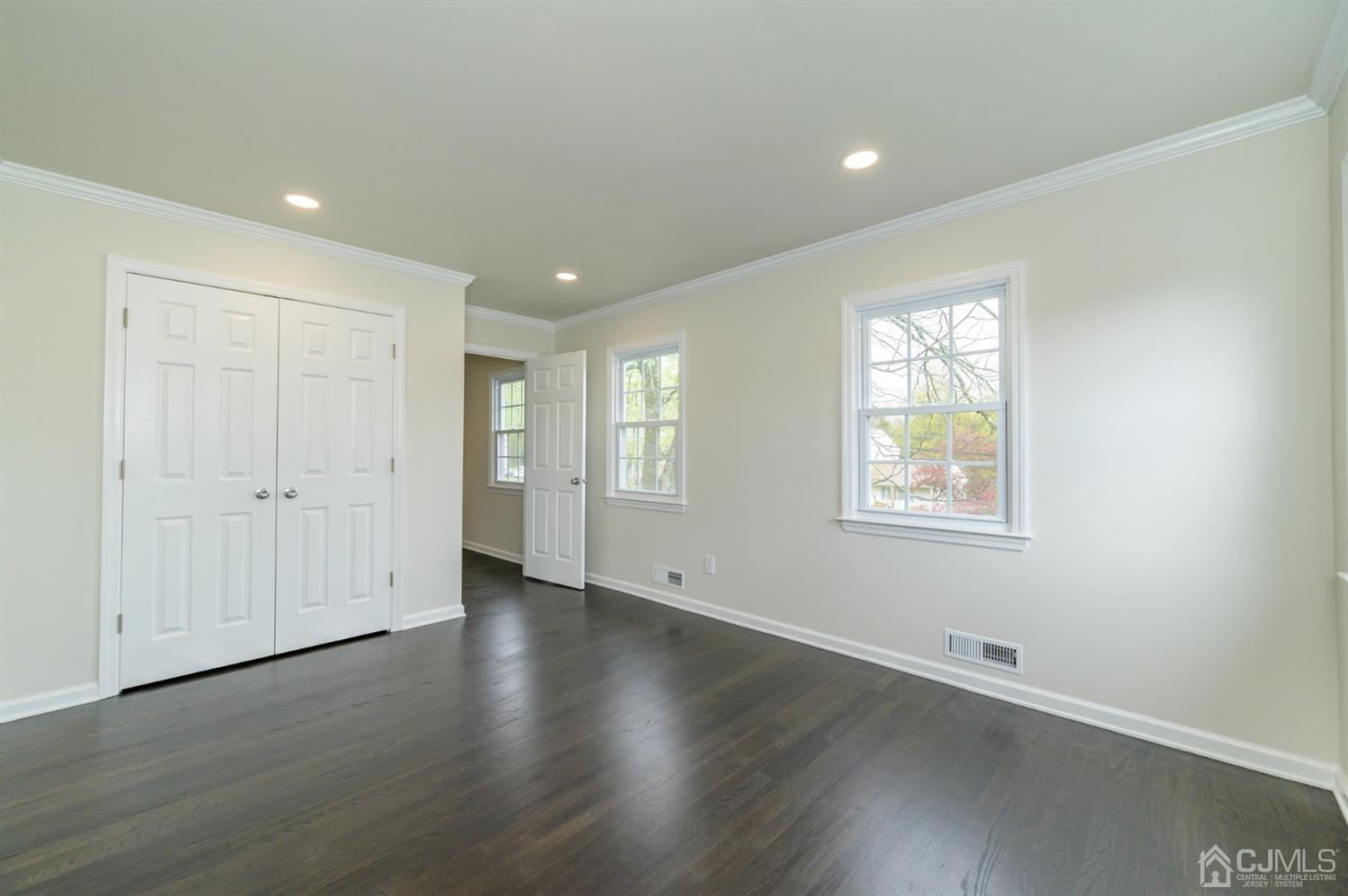 14 Shetland Road Florham Park, NJ 07932 - Photo 27 of 40 an empty room with wooden floor and windows