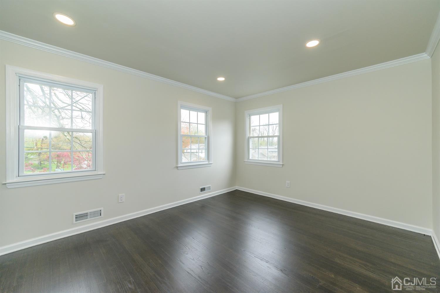 14 Shetland Road Florham Park, NJ 07932 - Photo 28 of 40 an empty room with wooden floor and windows