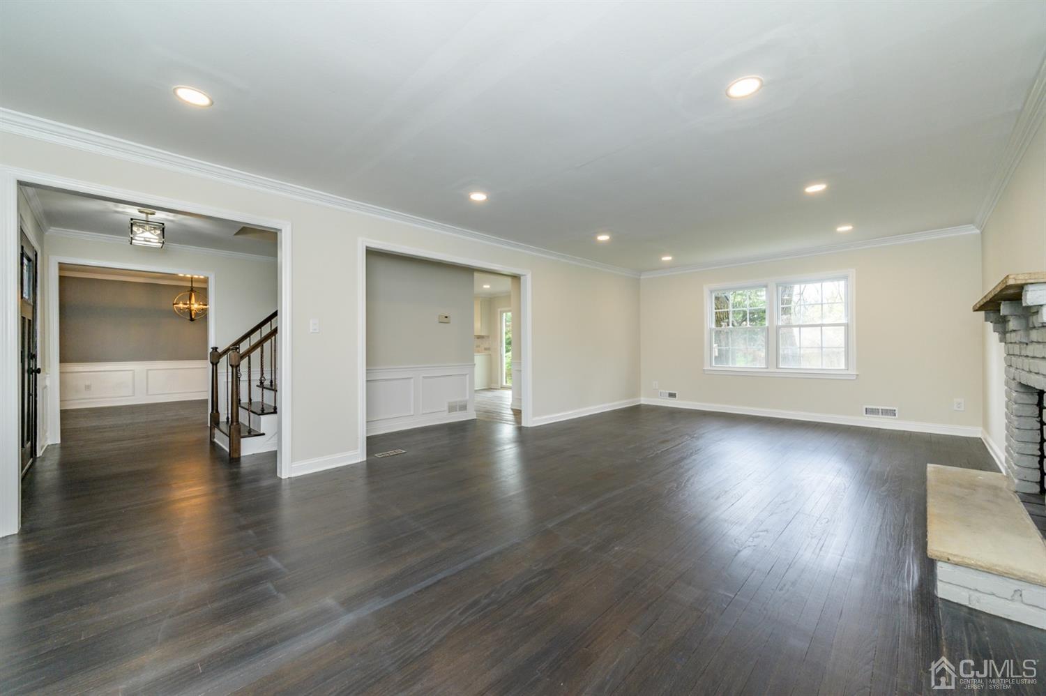 14 Shetland Road Florham Park, NJ 07932 - Photo 5 of 40 an empty room with wooden floor and windows