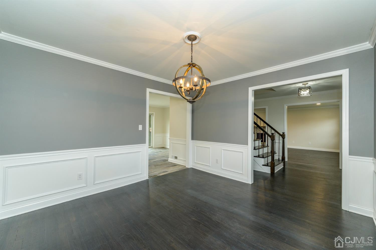 14 Shetland Road Florham Park, NJ 07932 - Photo 9 of 40 a hallway with wooden floor chandelier and entryway
