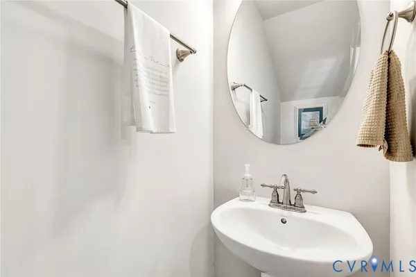 a bathroom with a sink and mirror