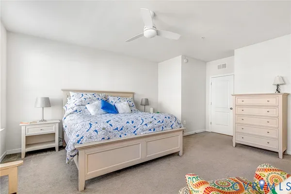 a bedroom with a bed and a dresser