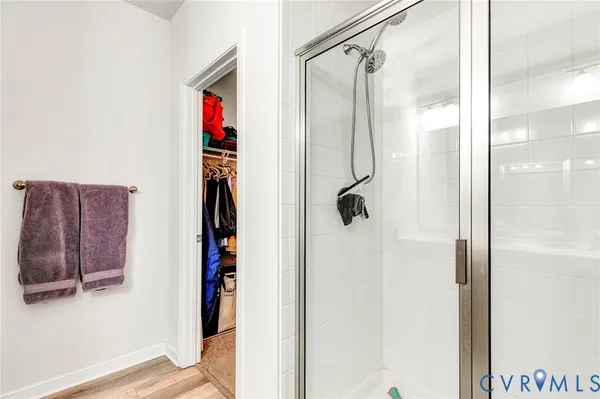 a bathroom with a shower and a mirror