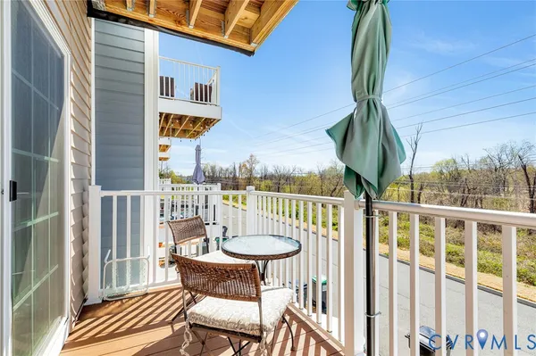 a view of a chairs and table in patio