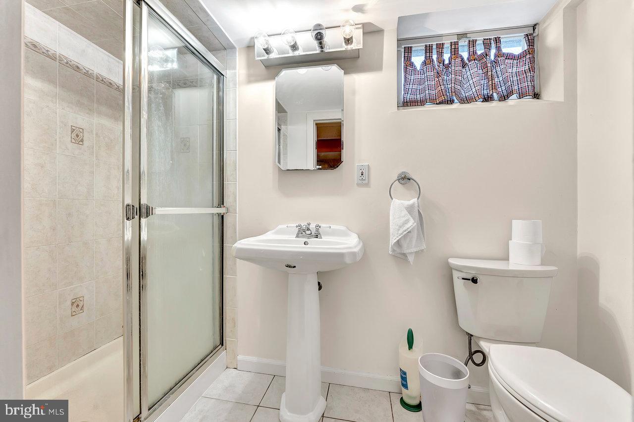 20 Wolfpack Road Hamilton, NJ 08619 - Photo 20 of 25 a bathroom with a toilet sink and mirror