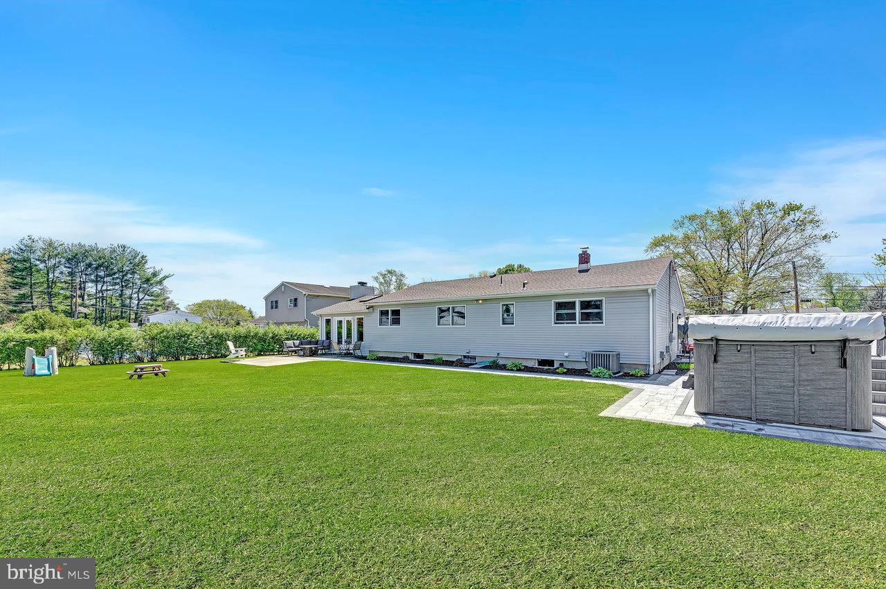 20 Wolfpack Road Hamilton, NJ 08619 - Photo 25 of 25 a view of a house with a big yard and a large tree