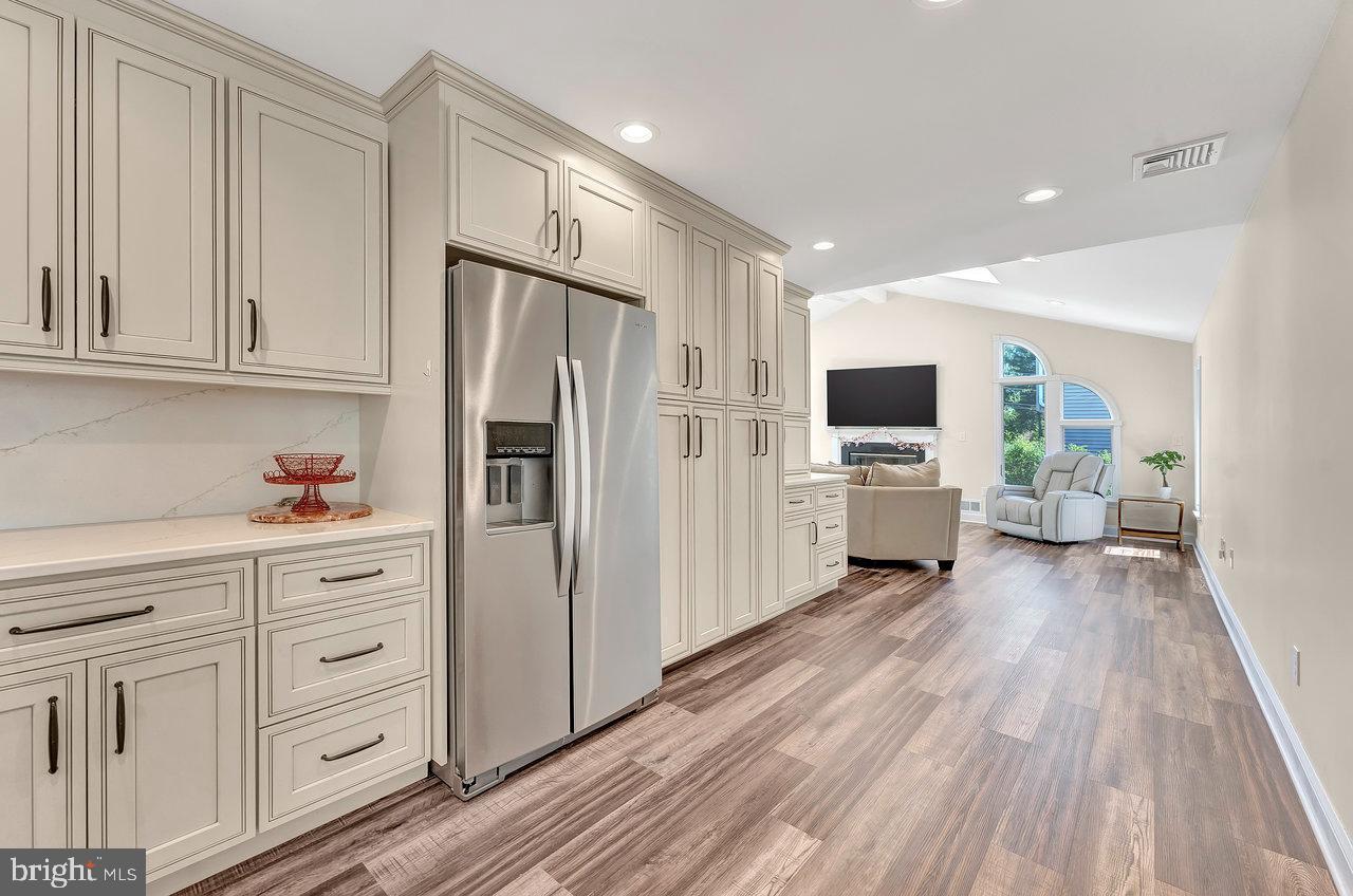20 Wolfpack Road Hamilton, NJ 08619 - Photo 7 of 25 a kitchen with white cabinets and stainless steel appliances