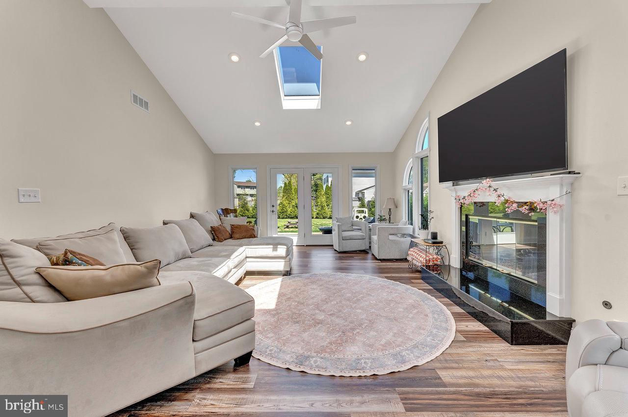 20 Wolfpack Road Hamilton, NJ 08619 - Photo 8 of 25 a living room with furniture and a flat screen tv
