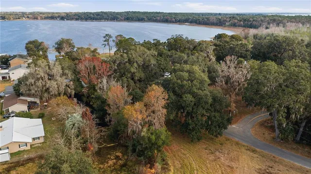 a view of a lake with houses in the back