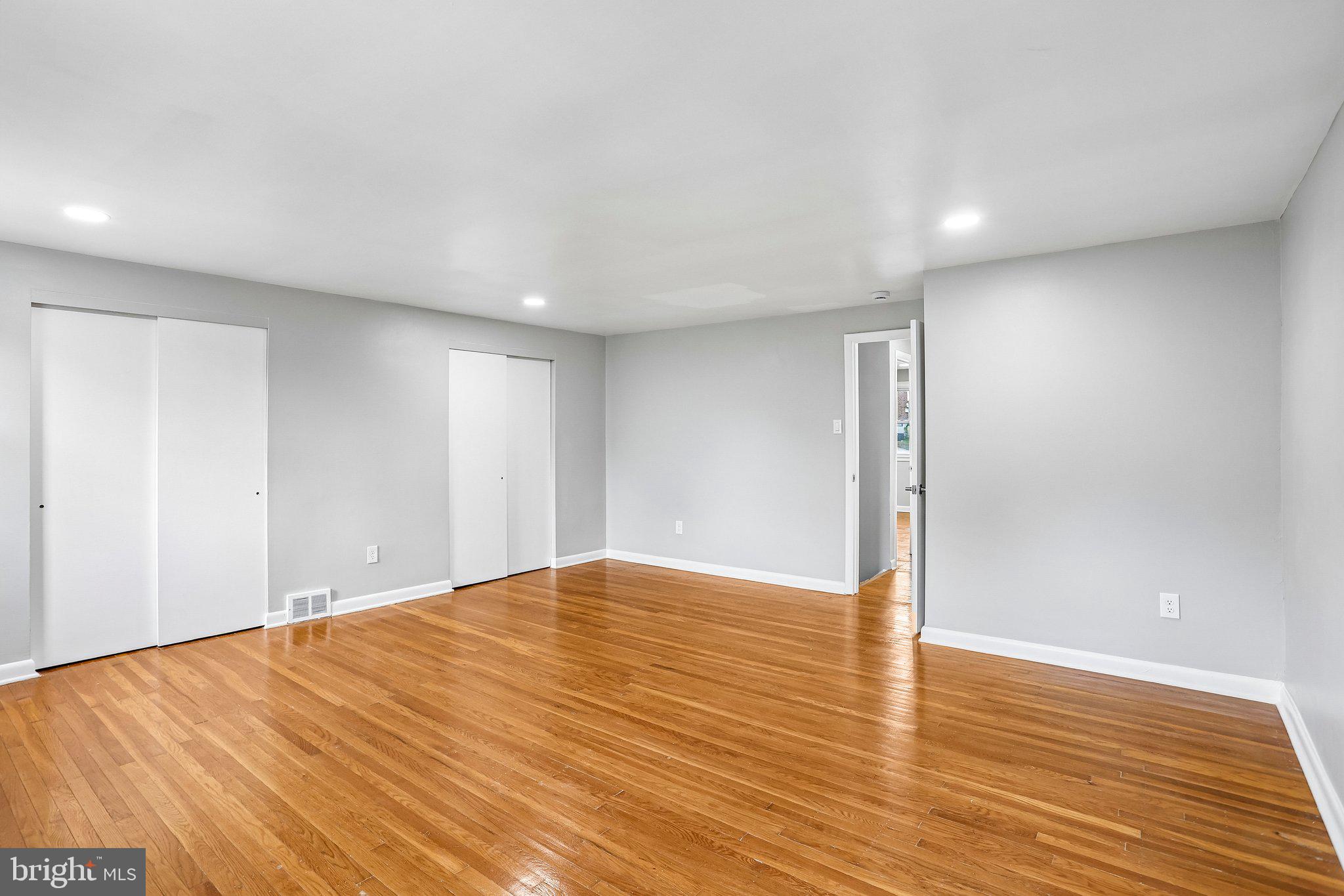 4008 Powell Road Brookhaven, PA 19015 - Photo 21 of 34 Spacious, modern room with hardwood floors.