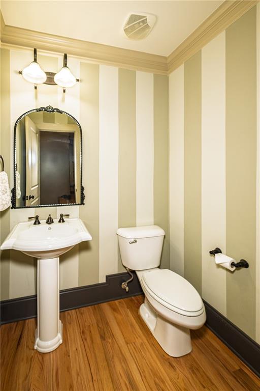 1103 Ridenour Court Northwest Kennesaw, GA 30152 - Photo 11 of 56 a bathroom with a sink toilet and mirror